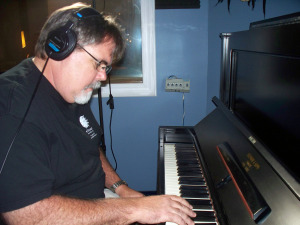 Jim Stafford of Eclipse Recording Company, on piano